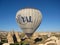 Royal ballons flying in the sunrise light in Cappadocia, Turkey above the Fairy ChimneysÂ rock formationÂ nearby Goreme